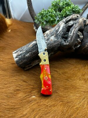 Couteau pliant lame damas 256 couches avec un manche en micarta piece unique ref v6